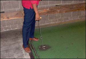 After - Use of a tool allows the dock leveler to be positioned while standing