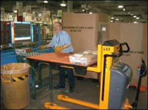 After - Pallet lift allows the person to raise the trays to waist height