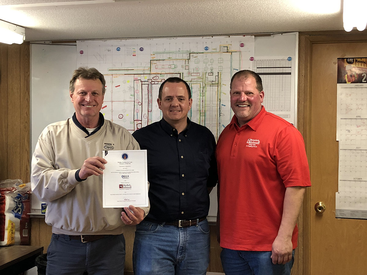 (left to right) Mark Hysell, Area Director, Eau Claire Area Office, US DOL-OSHA, Ernie Stracener, Wisconsin Onsite Consultation Program Manager and Mark Larson, Safety Manager, Market and Johnson, Inc.