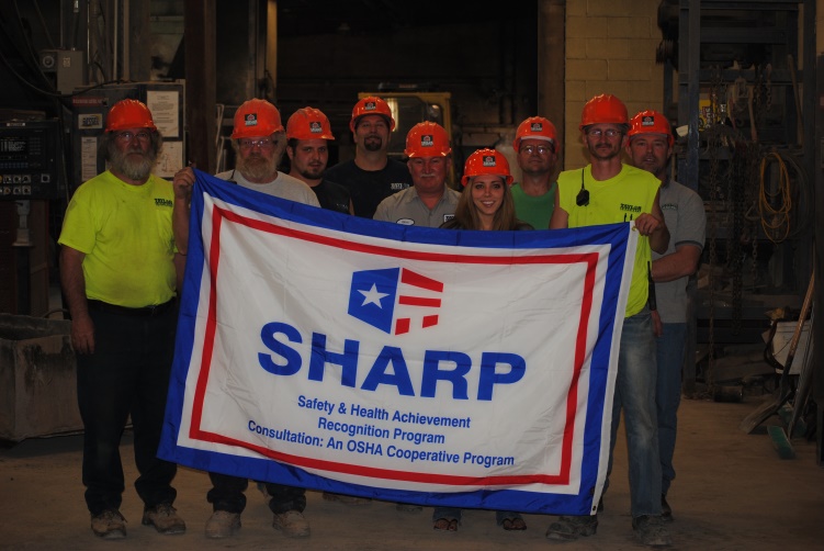Taylor Concrete Products, Inc., celebrating their SHARP recognition with employees following a safety training session.
