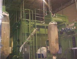 Combination caged ladders and platforms added to original equipment by the Process Hazards Safety Subcommittee.