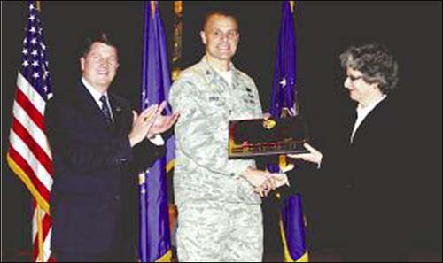 88th Air Base Wing Commander Col. Bradley Spacy and 88th ABW Vice Director Randy Parker accept the VPP Star Award, OSHA's highest level of recognition from Sandra Taylor, Deputy Regional Administrator, Region V, US Department of Labor, OSHA.