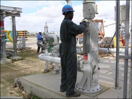 Workers at DynMcDermott Petroleum Operations Company wearing Personal Protective Equipment (PPE)