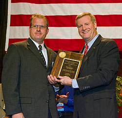 Former-Assistant Secretary Edwin G. Foulke, Jr., presenting SGE award to Michael Pendergrass