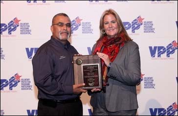 Acting Director, Directorate of Cooperative and State Programs, Kimberly A. Locey, presenting SGE award to Gilbert Aceves