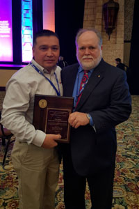 Office of Partnerships and Recognition Director, David Hamel, with winner, Mark Moya, Honeywell Technology Solutions, Inc., Colorado Springs, CO 