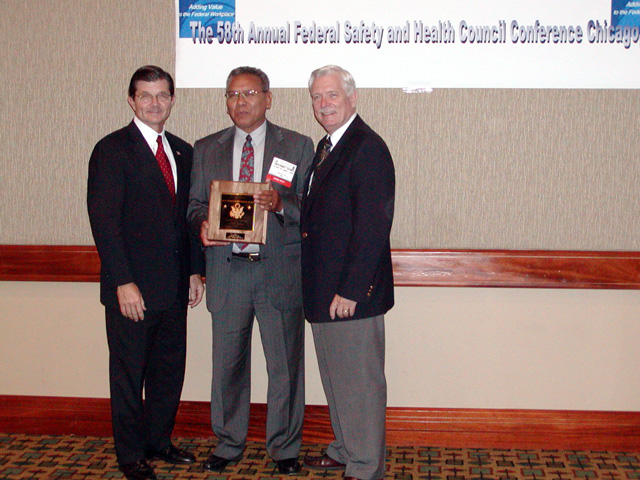 OSHA Region VI Federal Agency Program Officer Geronimo Gomez, with Assistant Secretary John L. Henshaw, and Deputy Assistant Secretary R. Davis Layne at the 2003 Federal Safety and Health Council Conference.