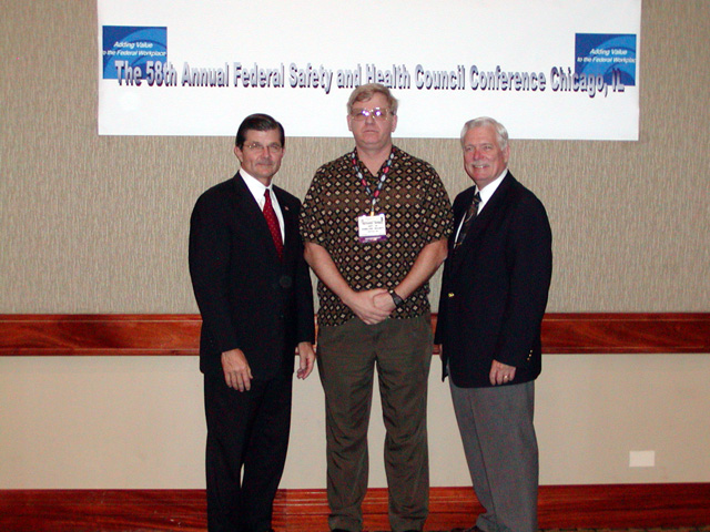 Federal Safety and Health Councilmember with Assistant Secretary John L. Henshaw, and Deputy Assistant Secretary R. Davis Layne.