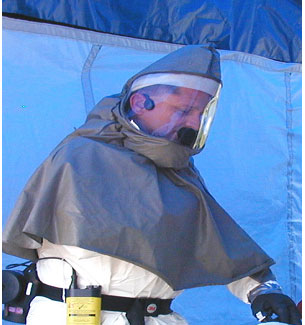 Temple-transducer style two-way radio headset stays in place under PAPR hoods