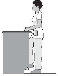 Depiction (profile view) of person standing at work surface with right foot on foot rest