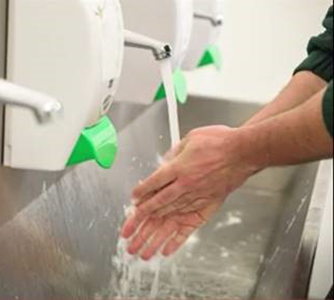 image of a worker demonstrating proper hand-washing
