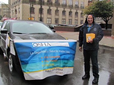 William Soto of OSHA's Buffalo office promotes workers' safety and rights at Puerto Rican and Hispanic Day Parade of Western New York